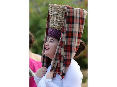 A member of the Kumintang Folk Dance group during dancing and musical entertainment at River Landing during the PotashCorp Fireworks Festival, September 2, 2016.