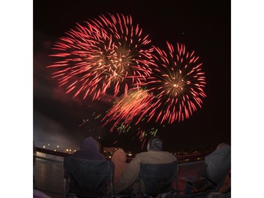 Spectators watch fireworks at the PotashCorp Fireworks Festival at River Landing in Saskatoon, September 3, 2016.