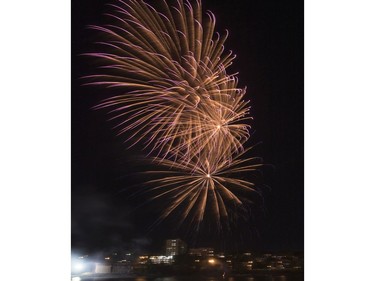 Spectators watch fireworks at the PotashCorp Fireworks Festival at River Landing in Saskatoon, September 3, 2016.