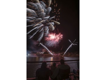 Spectators watch fireworks at the PotashCorp Fireworks Festival at River Landing in Saskatoon, September 3, 2016.