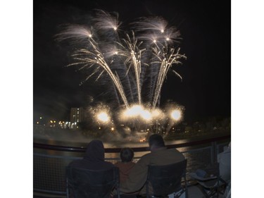 Spectators watch fireworks at the PotashCorp Fireworks Festival at River Landing in Saskatoon, September 3, 2016.