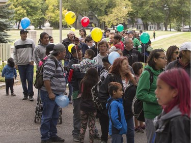 People lined up in Victoria Park for burgers and drink, along with live music and balloons, September 5, 2016, during the Saskatoon & District Labour Council's Labour Day BBQ in the park.