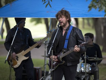 People lined up in Victoria Park for burgers and drink, along with live music and balloons, September 5, 2016, during the Saskatoon & District Labour Council's Labour Day BBQ in the park.