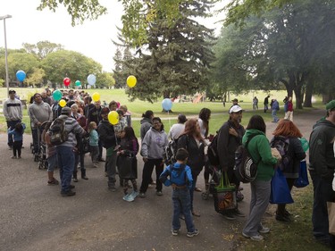 People lined up in Victoria Park for burgers and drink, along with live music and balloons, September 5, 2016, during the Saskatoon & District Labour Council's Labour Day BBQ in the park.