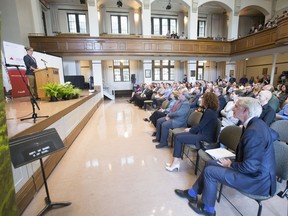 U of S PhD student Holly Annand addresses a crowd at the announcement of a $77.8 million grant for the new Global Water Futures program.