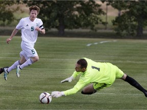 Goalie Dylon Powley of the Grant McEwan Griffins, right, makes the save on a shot from Mitchell Bauche of the University of Saskatchewan Huskies in CIS soccer action at Potash Corp Park in Saskatoon on Friday. (GREG PENDER/STAR PHOENIX)