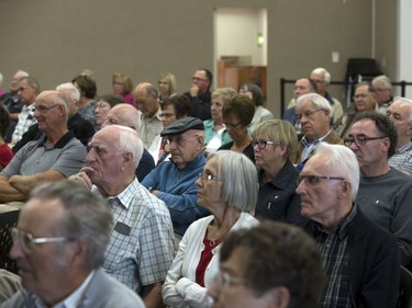 People listen to mayoral candidates Don Atchison, Kelley Moore, Henry Dayday and Charlie Clark during a town hall meeting at Cathedral of the Holy Family hosted by Canadian Condominium Institute North Saskatchewan Branch, September 14, 2016.
