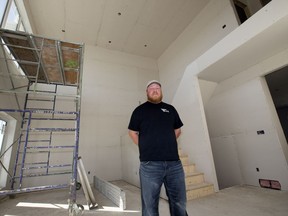 Mike Lane, co-owner of Titan Drywall, in a Rosewood home his company drywalled. Lane is concerned about new tariffs on gypsum board products.