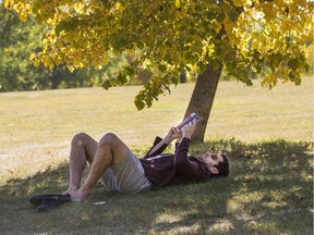 Alexis Combe enjoys some reading in the shade of Victoria Park, September 15, 2016.