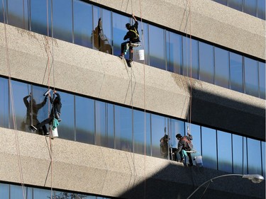 Window washers work on the Concentra building on Third Avenue North, September 16, 2016.