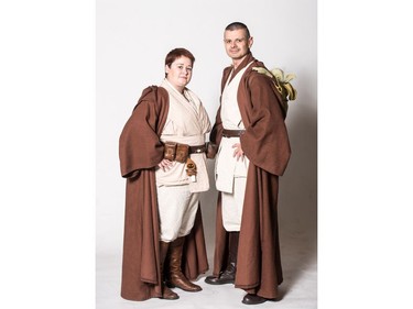 Nikki (L) and Donovan Beaudin, dressed as Jedi, pose for a photograph during the Saskatoon Comic and Entertainment Expo at Prairieland Park in Saskatoon, September 17, 2016.