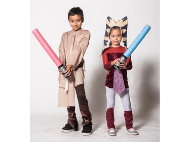 Leandro as Anakin Skywalker and Eva as Ahsoka Tano pose for a photograph during the Saskatoon Comic and Entertainment Expo at Prairieland Park in Saskatoon, September 17, 2016.