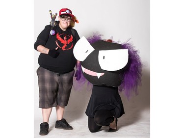 Ali and Michelle Paul, as Pokemon Trainer and Ghastly, pose for a photograph during the Saskatoon Comic and Entertainment Expo at Prairieland Park in Saskatoon, September 17, 2016.
