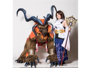 Silver Lining Cosplay members as Ifrit and Yuna from Final Fantasy X pose for a photograph during the Saskatoon Comic and Entertainment Expo at Prairieland Park in Saskatoon, September 17, 2016.