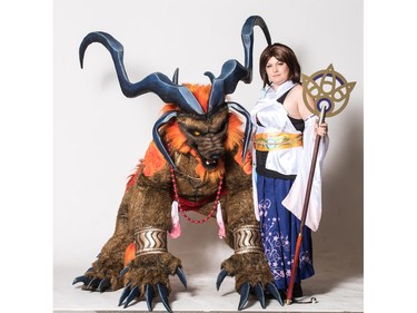 Silver Lining Cosplay members as Ifrit and Yuna from Final Fantasy X pose for a photograph during the Saskatoon Comic and Entertainment Expo at Prairieland Park in Saskatoon, September 17, 2016.