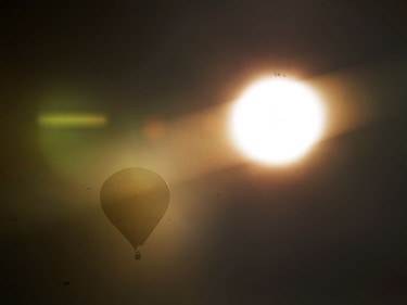 A hot air balloon floats over Saskatoon, September 20, 2016.