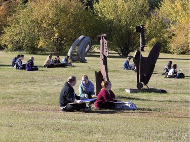 Introductory drawing students at the University of Saskatchewan practice drawing amongst the sculptures on Seminary Crescent on campus, September 20, 2016.