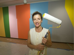 Artist Leah Rosenberg with her artwork from the show Everyday, A Colour at the Kenderdine Art Gallery.