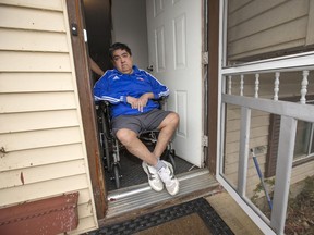 Sergio Lienlaf in the doorway of his Saskatoon home. Lienlaf, who suffers from a rare muscular disease, says the generosity of a local construction company means he will be able to venture out again after years spent inside.