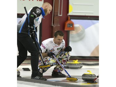 Skips Brad Jacobs (L) and Thomas Ulsrud in action during the championship final in the World Curling Tour's College Clean Restoration Curling Classic at the Nutana Curling Club, September 26, 2016.