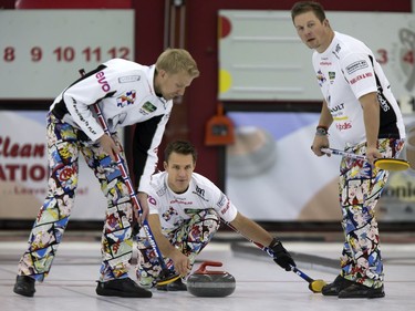 Skip Thomas Uslrud (C) with sweepers Havard Vad Petersson and Christoffer Svae in action during the championship final in the World Curling Tour's College Clean Restoration Curling Classic at the Nutana Curling Club, September 26, 2016.