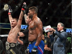 Stipe Miocic has his arm raised by the referee after defeating Alistair Overeem, from the Netherlands, during a heavyweight title bout at UFC 203 on Saturday, Sept. 10, 2016, in Cleveland.
