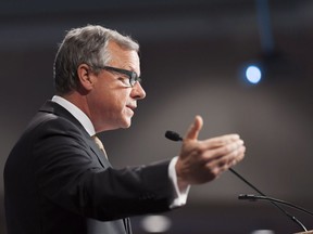 Saskatchewan Premier Brad Wall gestures during a speech on climate change to the Regina Chamber of Commerce at the Conexus Arts Centre in Regina, Saskatchewan on Tuesday October 18, 2016. THE CANADIAN PRESS/Michael Bell