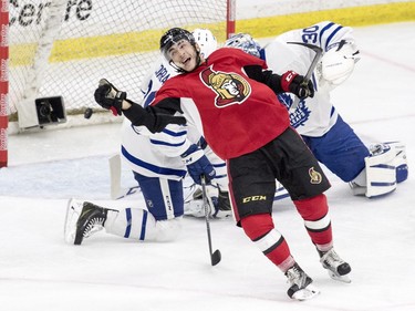 Ottawa Senators centre Phil Varone celebrates as the puck gets past Toronto Maple Leafs goalie Antoine Bibeau and defenceman Frank Corrado during the third period of an NHL pre-season hockey game in Saskatoon, October 4, 2016.
