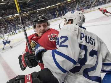 Ottawa Senators defenceman Dion Phaneuf and Toronto Maple Leafs forward Brandon Prust collide into the boards during the first period of an NHL pre-season hockey game in Saskatoon, October 4, 2016.