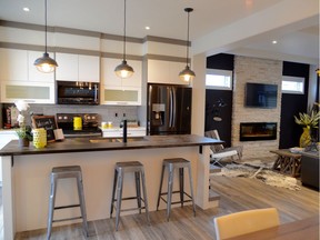 Doug and Reagan Elder, owners of Pure Developments, chose a modern vibe with touches of industrial chic, for their entry in the Brighton Parade of Homes. The two-storey, 1,469 square foot Bellmont model home offers a pleasing open concept floor plan on the main floor. (Photo: Jeannie Armstrong)