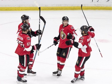 L-R: Ottawa Senators defenceman #65 Erik Karlsson, right wing #9 Bobby Ryan, defenceman #6 Chris Wideman and centre #19 Derick Brassard celebrate their game-winning goal over the Toronto Maple Leafs during overtime of an NHL pre-season hockey game in Saskatoon, October 4, 2016.