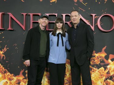 L-R: Ron Howard, Felicity Jones and Tom Hanks pose for photographers during a photo call for "Inferno" in London, England, October 12, 2016.