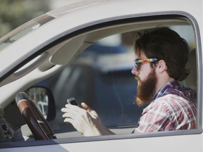 Saskatchewan drivers are being reminded to put their cellphones away in light of a record number of distracted driving tickets in March
