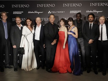 L-R: David Koepp, Ben Foster, Sidse Babett Knudsen, Ron Howard, Tom Hanks, Ana Ularu, Felicity Jones, Omar Sy, Irrfan Khan and Dan Brown pose for a group photo at the premiere of "Inferno," based on a novel by Dan Brown, at the opera house in Florence, Italy, October 8, 2016.