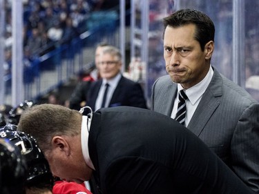 Ottawa Senators head coach Guy Boucher looks on as his team takes on the Toronto Maple Leafs during the first period of an NHL pre-season hockey game in Saskatoon, October 4, 2016.