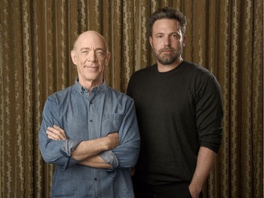 J. K. Simmons (L) and Ben Affleck pose at The Four Seasons Hotel in Los Angeles on September 30, 2016 to promote "The Accountant."