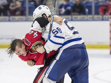 Ottawa Senators centre Jean-Gabriel Pageau fights with Toronto Maple Leafs defenceman Andrew Nielsen during the second period of an NHL pre-season hockey game in Saskatoon, October 4, 2016.