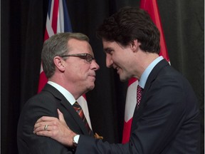 Prime Minister Justin Trudeau greets Saskatchewan Premier Brad Wall on Nov. 23, 2015, in Ottawa.