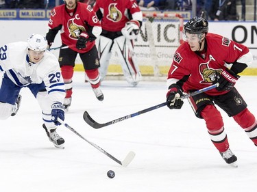 Toronto Maple Leafs' William Nylander and Ottawa Senators centre Kyle Turris battle for the puck during the first period of an NHL pre-season hockey game in Saskatoon, October 4, 2016.