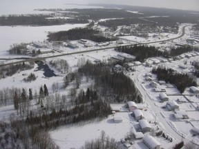 The northern community of La Ronge, seen here in this 2002 aerial photo, is expected to be hit by 10 to 15 centimetres of snow before Monday morning.