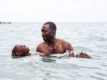 Alex Hibbert (L) and Mahershala Ali star in "Moonlight."