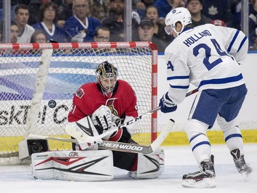 Toronto Maple Leafs centre Peter Holland moves the puck against the Ottawa Senators during the second period of an NHL pre-season hockey game in Saskatoon, October 4, 2016.