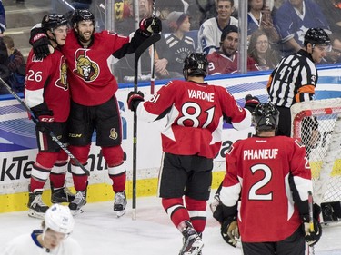L-R: Ottawa Senators left wing #26 Matt Puempel, defenceman #65 Erik Karlsson, centre #81 Phil Varone and defenceman #2 Dion Phaneuf celebrate a goal during the third period of an NHL pre-season hockey game in Saskatoon, October 4, 2016.