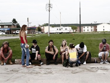 Riley Keough (standing) and Shia LaBeouf (C) star "American Honey."
