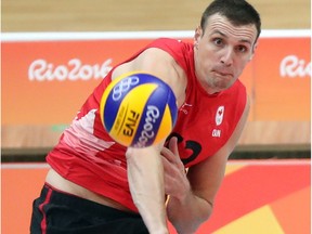 Gavin Schmitt of Team Canada serves against Team Italy during a preliminary match during the 2016 Rio Olympics in Rio de Janeiro, Brazil on Monday August 15, 2016. Dave Abel/Toronto Sun/Postmedia Network