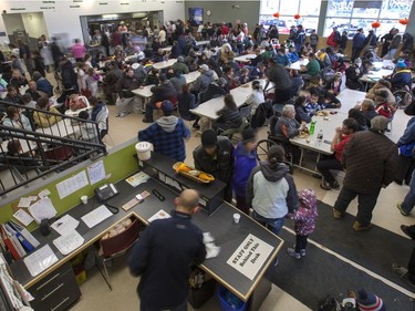 All hands on deck at the annual Thanksgiving Day meal at the Friendship Inn where more than 20 volunteers of all ages, along with staff members, served dinner to the needy that were seated, lined up inside and outside waiting for a warm turkey meal, October 10, 2016.