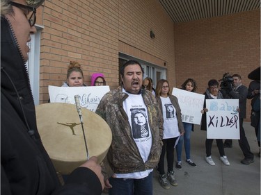 Family and friends, including grandfather Jeffery Longman, were outside Saskatoon's Provincial Court House and sang honour songs for baby Nikosis Jace Cantre before speaking angrily after the youth plead guilty to murder in the baby's death, October 12, 2016.