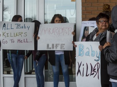The scene outside Saskatoon's Provincial Court House as friends and family members gather after the youth plead guilty to murder in the death of baby Nikosis Jace Cantre, October 12, 2016.