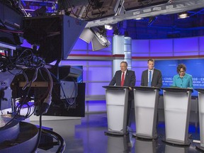 Don Atchison, Charlie Clark and Kelley Moore get ready for a mayoral forum in the CTV Saskatoon studios Thursday. (GORD WALDNER/Saskatoon StarPhoenix)