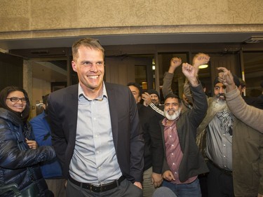 The new mayor of Saskatoon, Charlie Clark, and a large group of supporters arrive at City Hall, October 26, 2016.